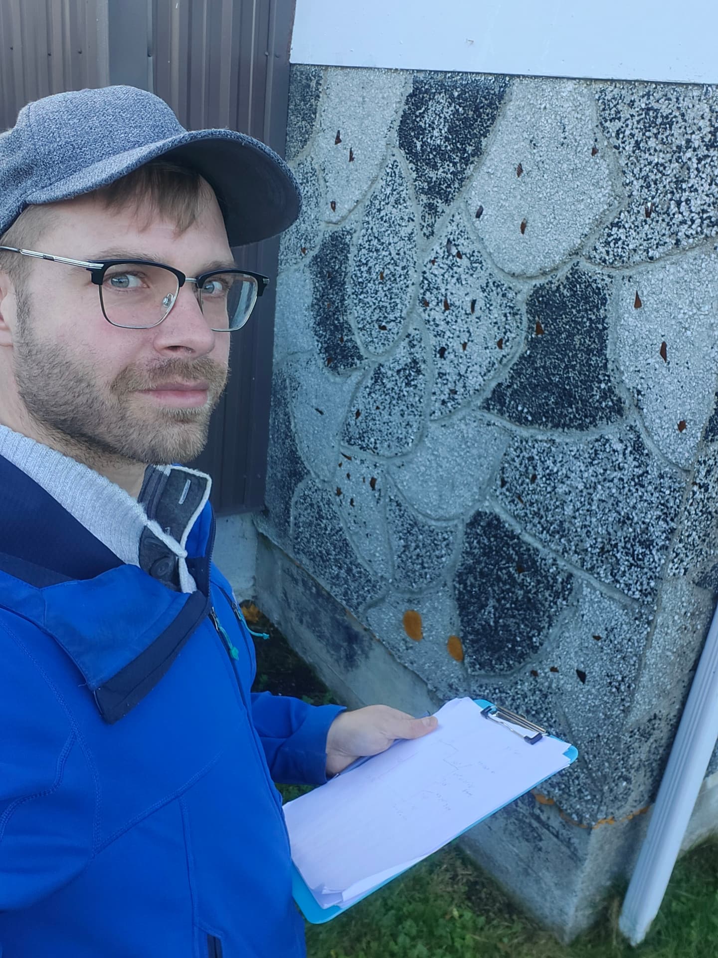 Jon inspecting a house exterior